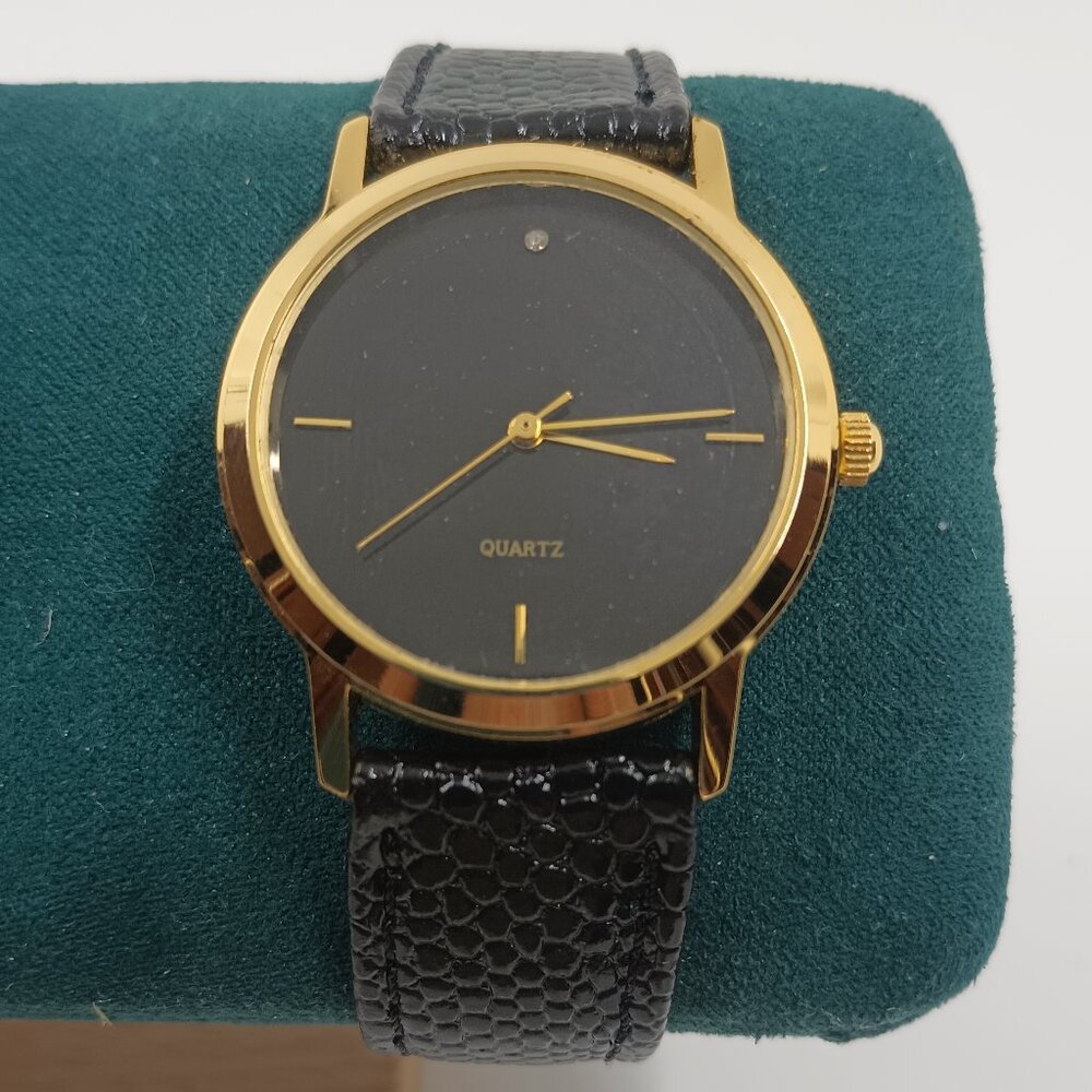 Vintage Gold Tone Steel Black Dial with Diamond and Embossed Croc black band.